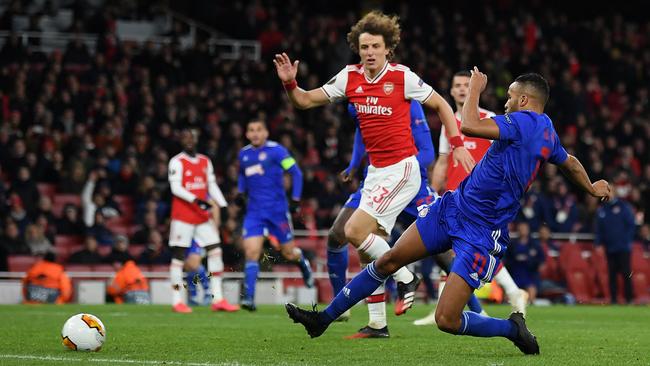 Youssef El Arabi scores for Olympiacos in extra time against Arsenal in their Europa League tie at Emirates Stadium. Picture: Getty Images
