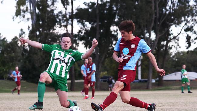 Junji Yasuda in action for Coomera against Southport's Mackenzie Woodward during their GCPL soccer match at Viney Park, Coomera. Photograph : Jason O'Brien