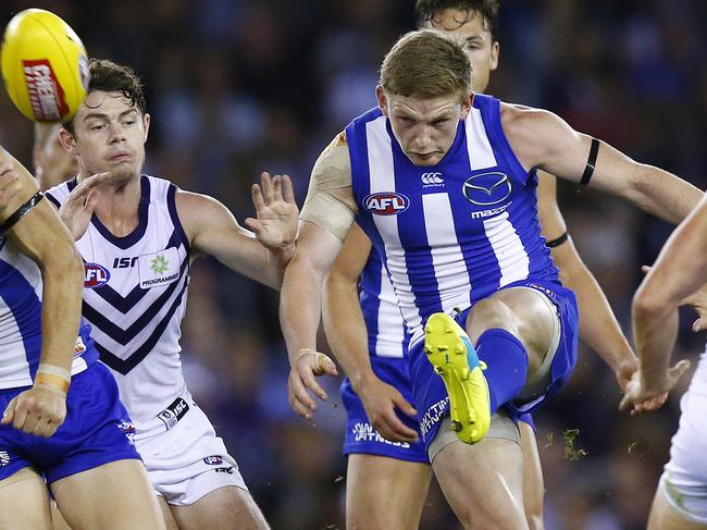 AFL: Round 4 North Melbourne V Fremantle at Etihad , North Melbourne's Jack Ziebell clears from the middle. 17th April 2016. Picture: Colleen Petch.