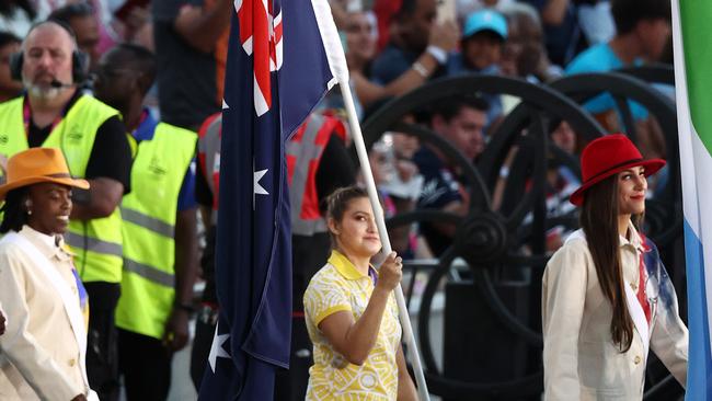 Melissa Wu carries the flag into Alexander Stadium. Picture: Michael Klein