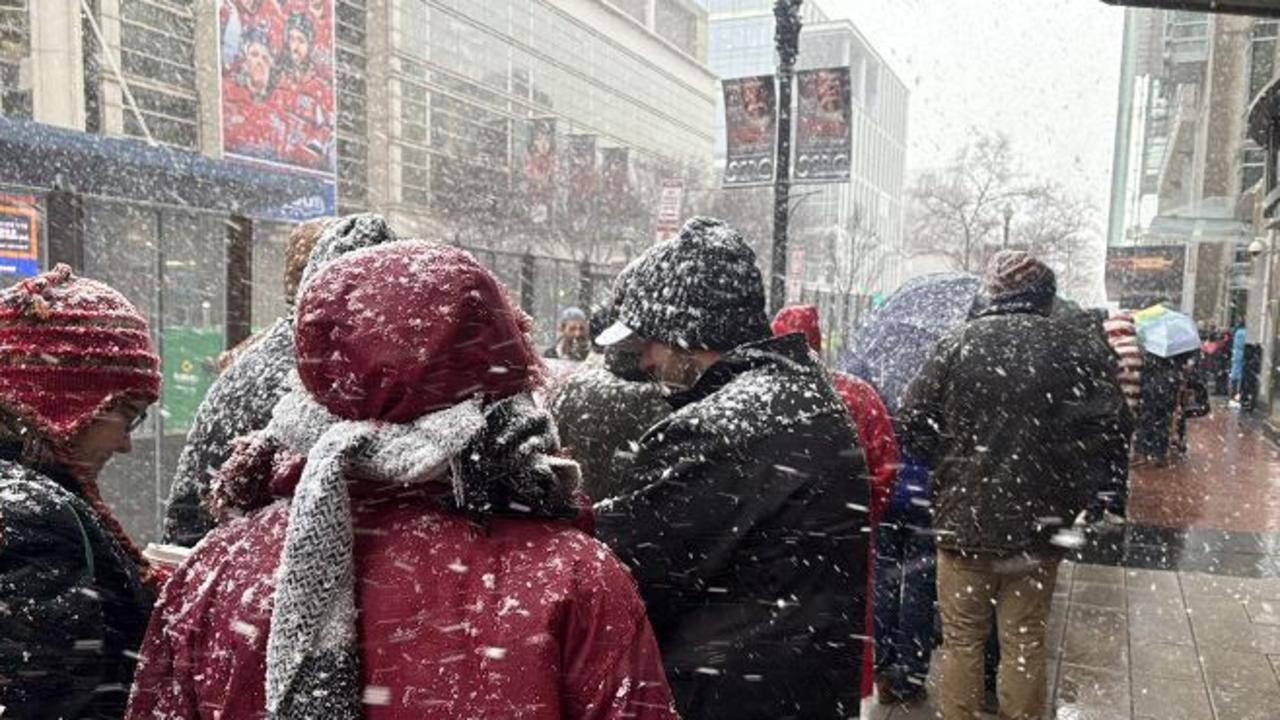 People still queuing in the snow and subzero temperatures minutes before Donald Trump was due to come in stage and still some distance from getting into the event. Picture: Benedict Brook.