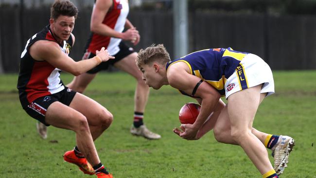 EDFL: Rupertswood’s Brock Landt gathers the ball. Picture: Hamish Blair