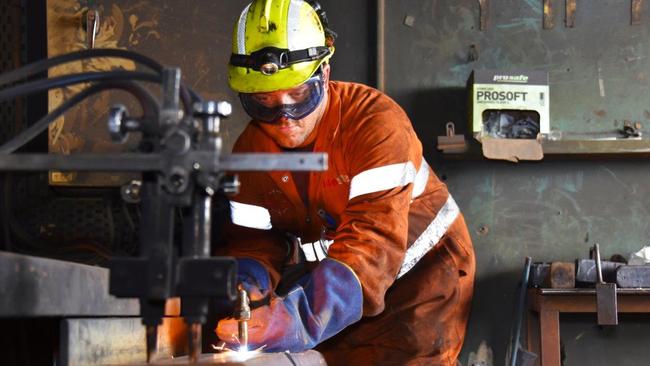 Mark Brine gets to work at Arrium’s rolling mill in Whyalla. An additional shift has created 44 new jobs.