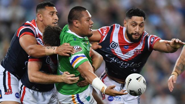 Joseph Leilua offloads for the Raiders. Picture: AAP Image/Dean Lewins