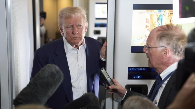 Trump speaks to reporters inside Air Force One on a recent flight to Rome. Picture: AP /Evan Vucci
