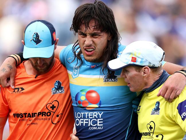 SYDNEY, AUSTRALIA - MARCH 23: Tino Fa'asuamaleaui of the Titans is helped from the field during the round three NRL match between Canterbury Bulldogs and Gold Coast Titans at Belmore Sports Ground, on March 23, 2024, in Sydney, Australia. (Photo by Brendon Thorne/Getty Images)