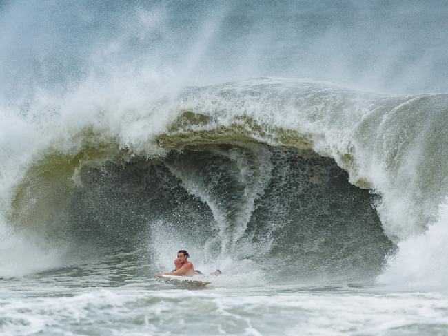 A bodyboarder takes advantage of the swell at Alexandra Headland on the Sunshine Coast. Picture: Lachie Millard