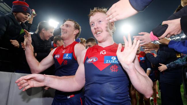 MELBOURNE, AUSTRALIA - MAY 04: Clayton Oliver of the Demons leaves the field after a win during the 2024 AFL Round 08 match between the Melbourne Demons and the Geelong Cats at The Melbourne Cricket Ground on May 04, 2024 in Melbourne, Australia. (Photo by Dylan Burns/AFL Photos via Getty Images)