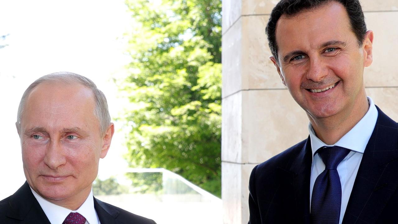 Partners in war crime: Putin and Assad together in 2008. Picture: Mikhail Klimentyev/Sputnik/AFP