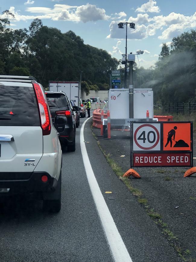 Vehicles waiting to get through the NSW/QLD border checkpoint.