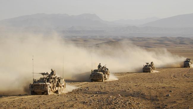 Australian Army soldiers from Special Operations Task Group drive in convoy in long-range patrol vehicles across an Afghanistan desert in northern Uruzgan province, Afghanistan.  (This image has been digitally altered for operational security.) *** Local Caption *** Australian Army soldiers from Special Operations Task Group (SOTG) along with Afghan Nation Security Forces conducted a counter-insurgency operation over several days in northern Uruzgan province, Afghanistan.  Operation Slipper is Australia's military contribution to international campaigns against terrorism, countering piracy in the Gulf of Aden, and maritime security. Under this operation, Australian forces contribute to the efforts of the NATO-led International Security Assistance Force in Afghanistan, aiming to bring security, stability and prosperity to the country and prevent Afghanistan again becoming a safe haven for international terrorists.   Australian forces are also contributing to the US-led International Coalition Against Terrorism efforts across the Middle East.  SOTG comprises personnel from 1st Commando Regiment, Special Air Service Regiment, 4th Battalion (Commando) of the Royal Australian Regiment, Incident Response Regiment, Special Operations Logistics Squadron and a variety of supporting units from the ADF. Picture: Department of Defence