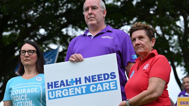 Kate Veach, Dr Sandy Donald and Trish Berrill lead the AWU rally outside Cairns Hospital. Picture: Emily Barker