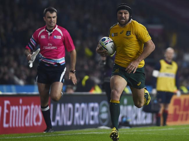 Matt Giteau charges away to put the seal on the Wallabies victory.