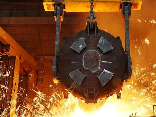 A worker works at a furnace at a steel plant in Dalian, China, earlier this month. PHOTO: REUTERS