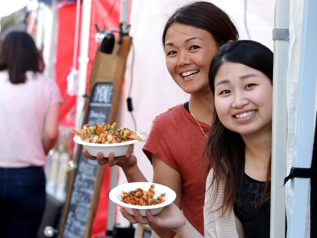 The girls at Mama Wonton Tomoko Saito, 36, and Rumiko Azumi, 26, show their wonton and noodle delights at the Chinatown Street Markets. Pics Tim Marsden