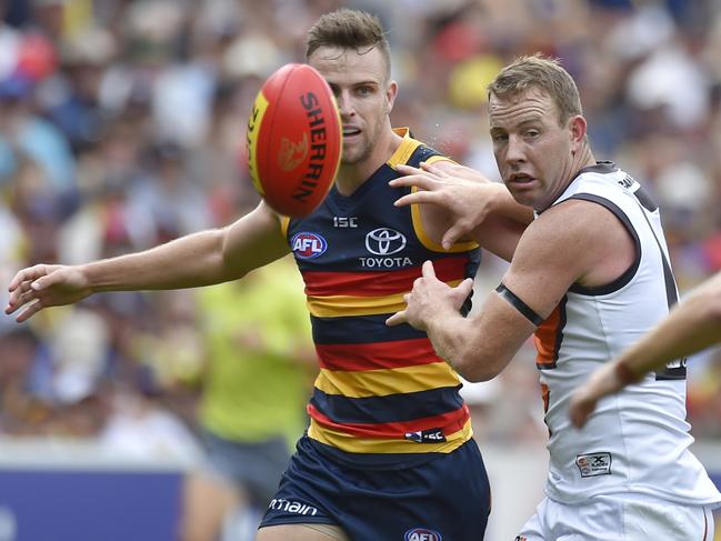 Brodie Smith of the Crows and Steve Johnson of the Giants  during the Round 1 AFL match between the Adelaide Crows and the Greater Western Sydney (GWS) Giants at Adelaide Oval in Adelaide, Sunday, March 26, 2017. (AAP Image/David Mariuz) NO ARCHIVING, EDITORIAL USE ONLY