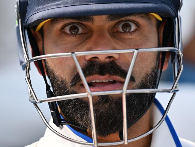 TOPSHOT - India's Virat Kohli prepares to walk out to bat ahead of play on day 5 of the ICC World Test Championship cricket final match between Australia and India at The Oval, in London, on June 11, 2023. (Photo by Glyn KIRK / AFP) / RESTRICTED TO EDITORIAL USE. NO ASSOCIATION WITH DIRECT COMPETITOR OF SPONSOR, PARTNER, OR SUPPLIER OF THE ECB