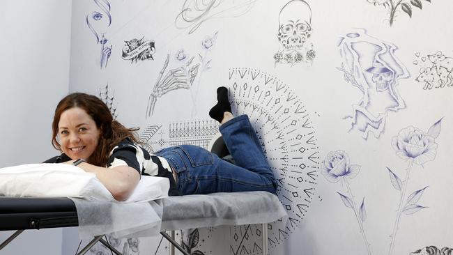 Stephanie Callanan, 36, receiving her very first tattoo from Scott Campbell at the Whole Glory installation at the Festival of Dangerous Ideas. Picture: Jonathan Ng