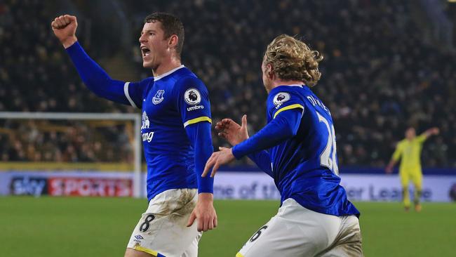 Everton's English midfielder Ross Barkley (L) celebrates scoring.