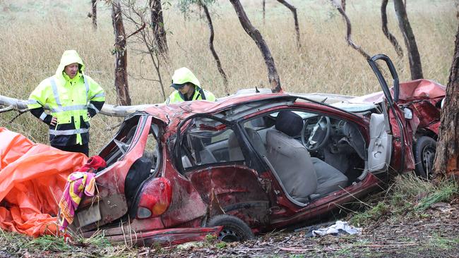 Police remove the crashed car at the Bochara fatal crash scene where four people were killed in a car accident. Picture: NCA NewsWire / David Crosling