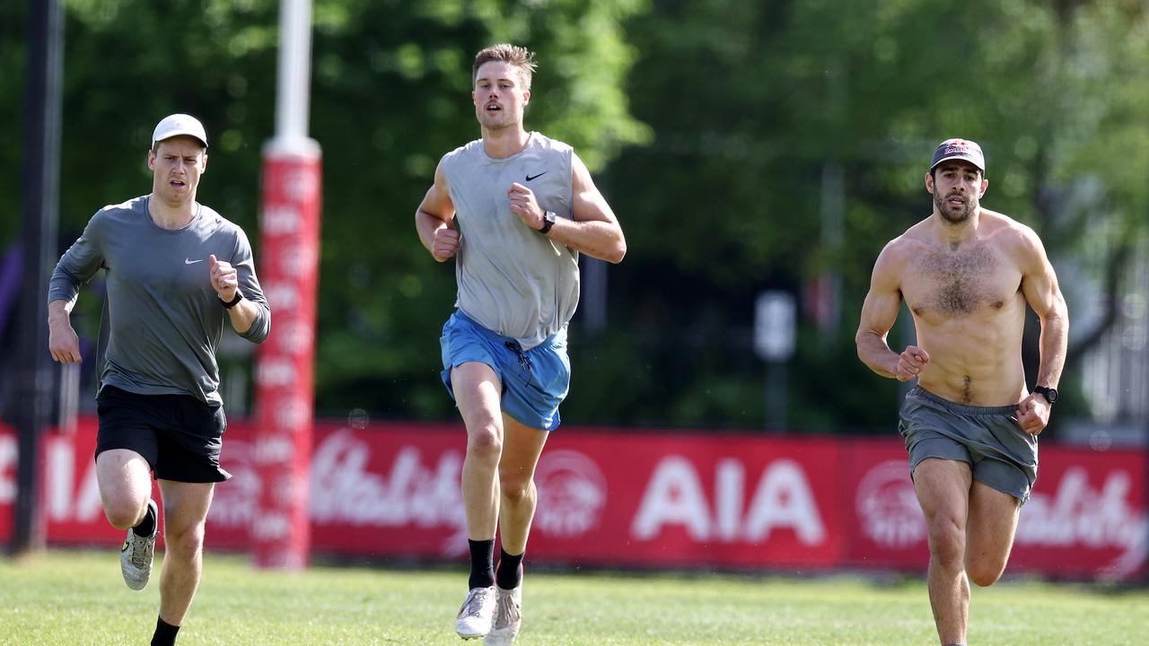 Melbourne recruits Lachie Hunter and Josh Schacke with Christian Petracca at Olympic Park. Picture: Michael Klein