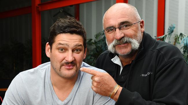 Mo legend Merve Hughes gives Brendan Fevola tips about growing the perfect moustache. Picture: Josie Hayden.