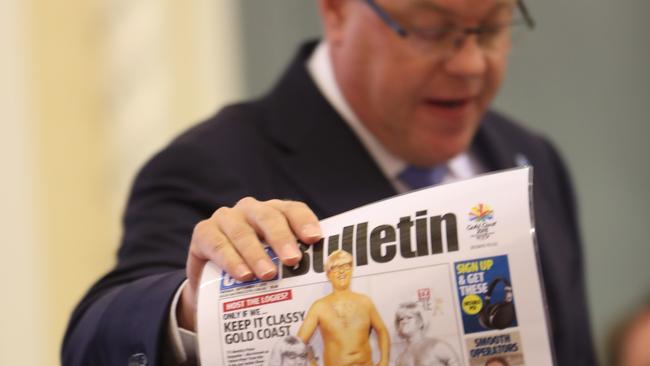 Tim Nicholls holds up the Bulletin report at Parliament during Question Time. Pic Annette Dew