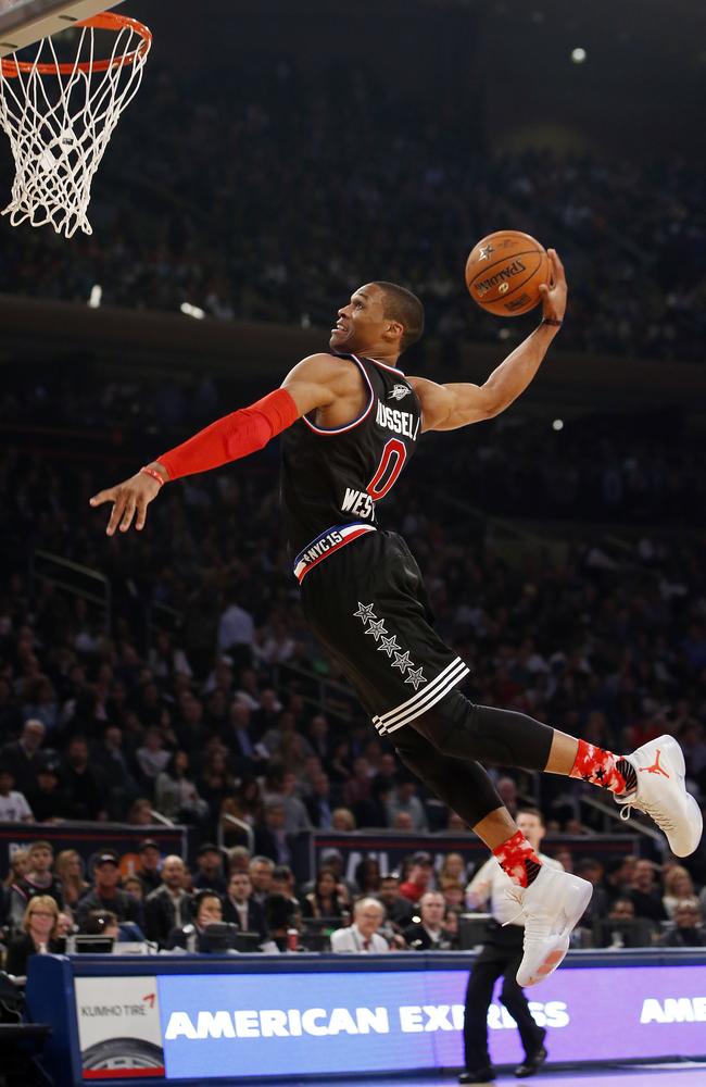 Russell Westbrook flies through the air to dunk during the first half of the NBA All-Star game.