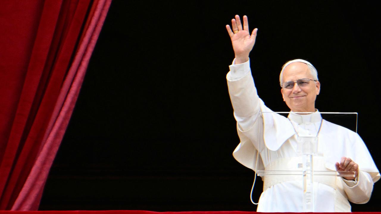 Pope Leo XIV waves to the crowd as he delivers the Regina Caeli prayer from the main central loggia of St Peter's basilica in The Vatican. Picture: Alberto PIZZOLI / AFP