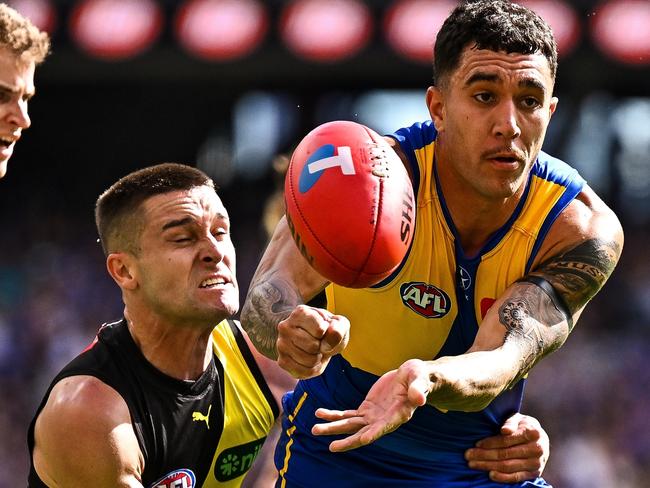 PERTH, AUSTRALIA - APRIL 14: Tyler Brockman of the Eagles handpasses the ball during the 2024 AFL Round 05 match between the West Coast Eagles and the Richmond Tigers at Optus Stadium on April 14, 2024 in Perth, Australia. (Photo by Daniel Carson/AFL Photos via Getty Images)