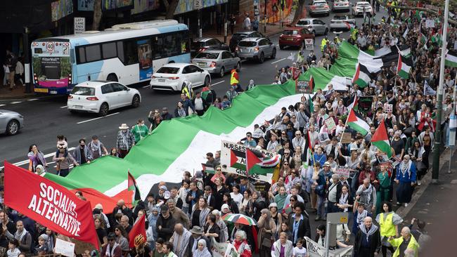 A giant Palestinian flag moves through Sydney on Sunday. Picture: NCA NewsWire / Jeremy Piper