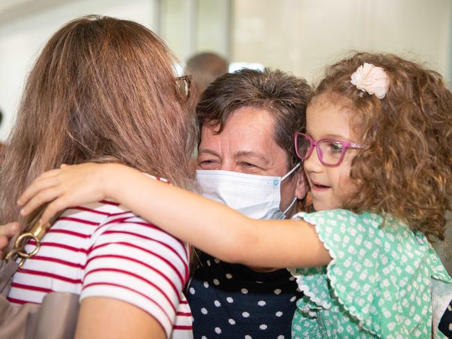 Zsofi Nemeth hugs mum Julianna Nemeth and daughter Lili Kaity, 5. Picture: Brad Fleet