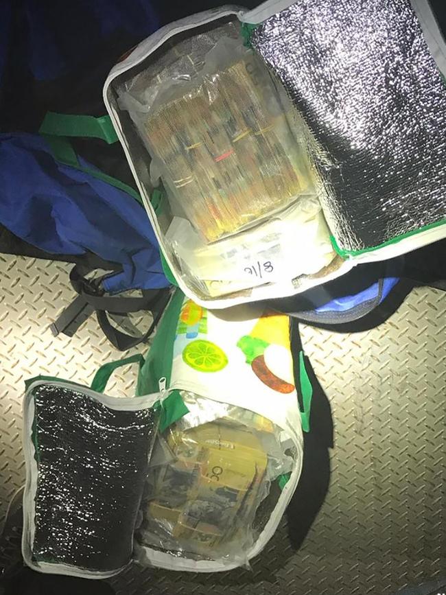 Highway patrol officers from Strike Force Raptor approached a prime mover parked at a service station in rural NSW where they found $2.75m in cash. The 2020 seizure would later be linked to Operation Ironside. Picture: NSW Police