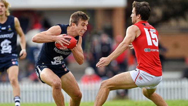 Souths' Joel Cross takes on Norths' Tom Schwarz. The star Panther kicked three first-half goals on Saturday. Picture: Tom Huntley