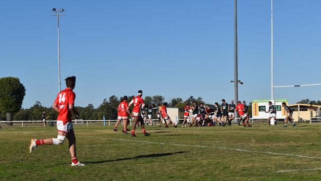 Spectators cheer on as they watch the B Grade St George vs Condamine match at the Roma Rugby Races at Bassett Park. Picture: Chloe Cufflin.