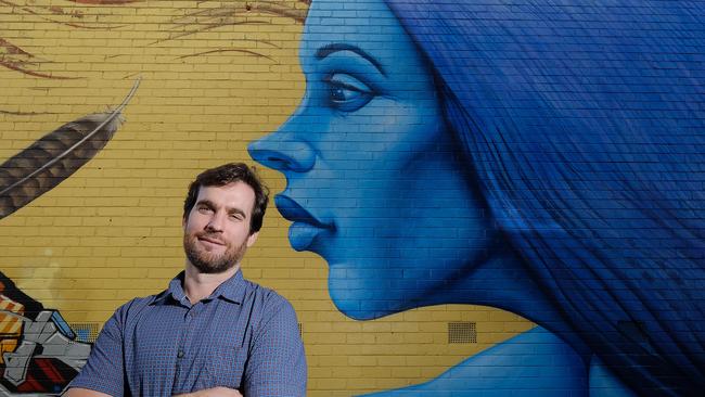 Artist Hayden Dewar outside the Sacred Heart School in Preston. Photo: Luis Enrique Ascui