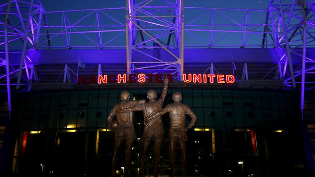 The entrance to Manchester United’s ground Old Trafford, lit up in tribute to Britain’s NHS earlier this month. The Premier League is in talks with broadcasters over a possible return to action. Picture: Getty Images