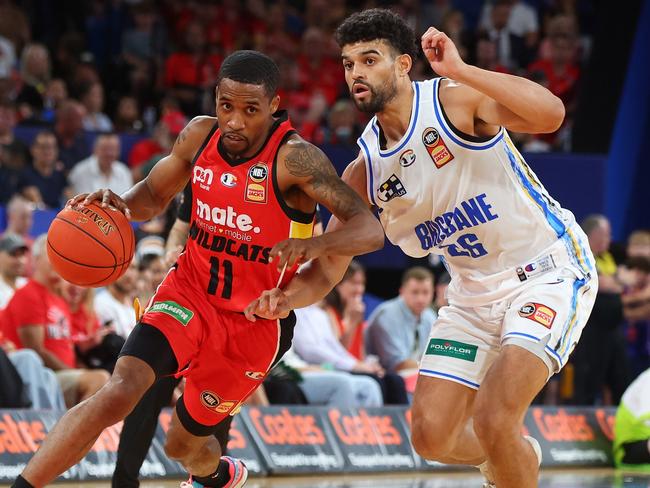 Sam McDaniel, pictured defending Wildcats star Bryce Cotton, wrecked his shoulder in the NBL1 season. Picture: Getty Images