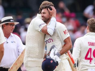 Stuart Broad and Jimmy Anderson embrace after the moral victory.