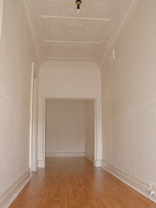 A hallway at one of Ms Slack-Smith and Mr Simpson’s Sydney properties, before they renovated. Picture: Supplied