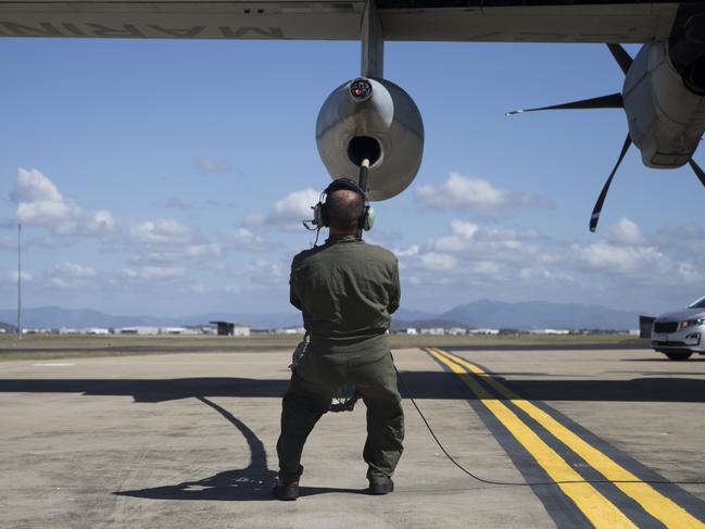 U.S. Marine Corps Staff Sgt. Joseph Szombathelyi, an aircrew master with Marine Aerial Refueler Transport Squadron (VMGR) 152, conducts a drogue change prior to taking off in support of Talisman Sabre 21 from Royal Australian Air Force Base Townsville, Australia, July 13, 2021. TS21, the ninth iteration and conducted since 2005, occurs biennially across Northern Australia. Australian, US and other multinational partner forces use Talisman Sabre to enhance interoperability by training in complex, multi-domain operations scenarios that address the full range of Indo-Pacific security concerts. (U.S. Marine Corps photo by Cpl. Bryant Rodriguez)