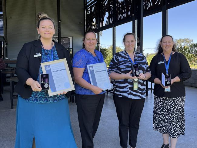 Michelle Wyllie, Rebecca Davenport, Louise Hetherington and Dee-Anne Kuilboer with the awards they received at the graduation event.