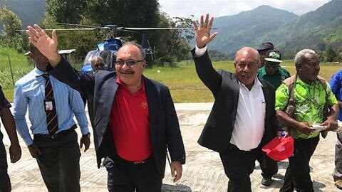 Papua New Guinea PM Peter O'Neill, left, and former PNG judge Don Sawong. 