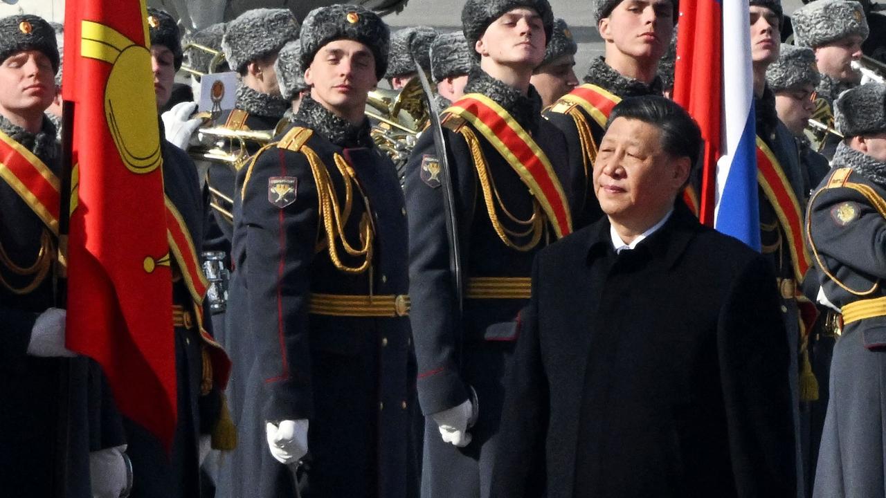 Xi Jinping walking past honour guards during a welcoming ceremony at Moscow’s Vnukovo Airport. Picture: Anatoliy Zhdanov/Kommersant/AFP