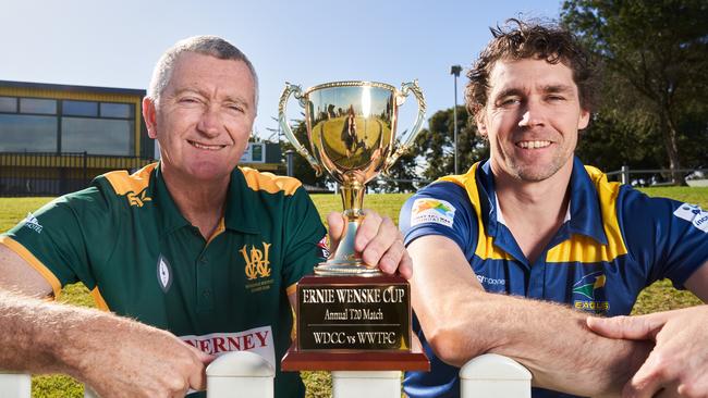 Woodville District Cricket Club chairman Tim Pillion with Woodville-West Torrens chief executive Luke Powell pay tribute to Ernie Wenske with a trophy named in his honour. Mr Wenske died last month. Picture: Matt Loxton