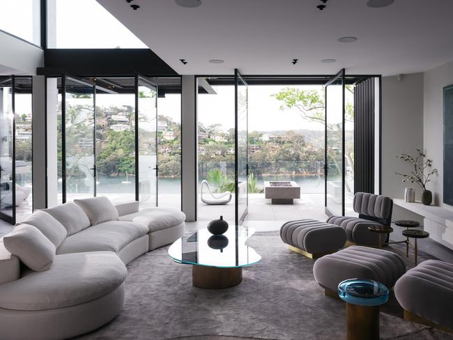 The expansive living room, looking out to the water. Picture: Felix Forest and styled by Joseph Gardner