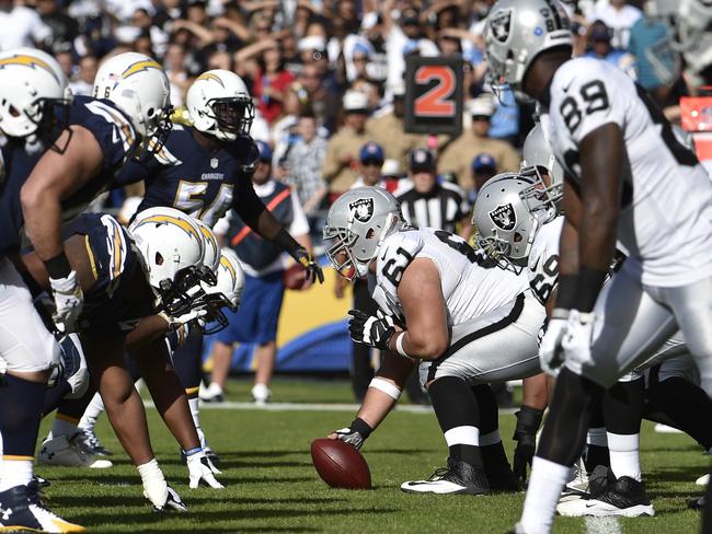 FILE - In this Sunday, Nov. 16, 2014 file photo,The Oakland Raiders and San Diego Chargers face off against each other during the second half of an NFL football game in San Diego. The Oakland Raiders and San Diego Chargers are planning a shared stadium in the Los Angeles area if both teams fail to get new stadium deals in their current hometowns. The teams announced plans for the $1.7 billion stadium in Carson in a joint statement Thursday night, Feb. 19, 2015. (AP Photo/Denis Poroy, File)