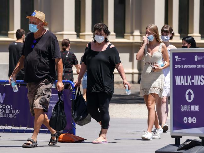 People line up for their booster vaccinations at the Royal Exhibition Building in Melbourne. Picture: NCA NewsWire / Ian Currie