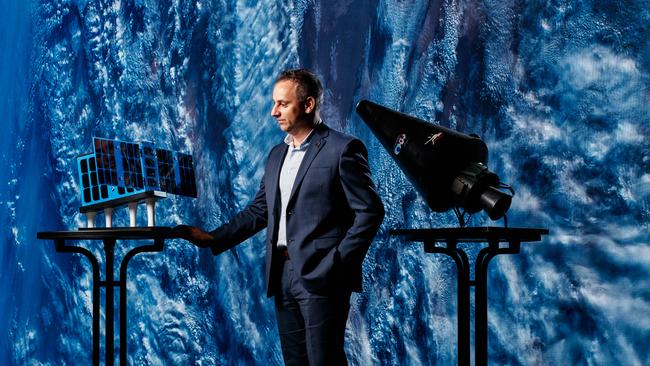 Enrico Palermo, head of the Australian Space Agency with a satellite at the Lab. Picture Matt Turner.