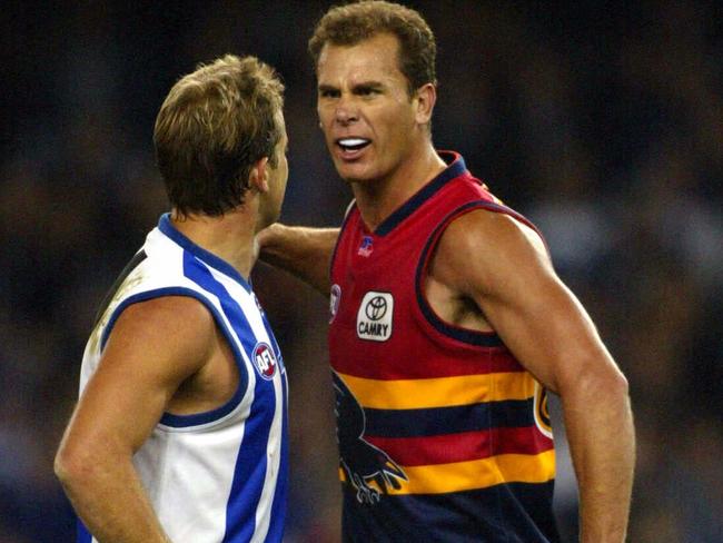 Wayne Carey and Glenn Archer meet..Kangaroos vs Adelaide at the Telstra Dome.2/05/03 pic COLIN MURTY